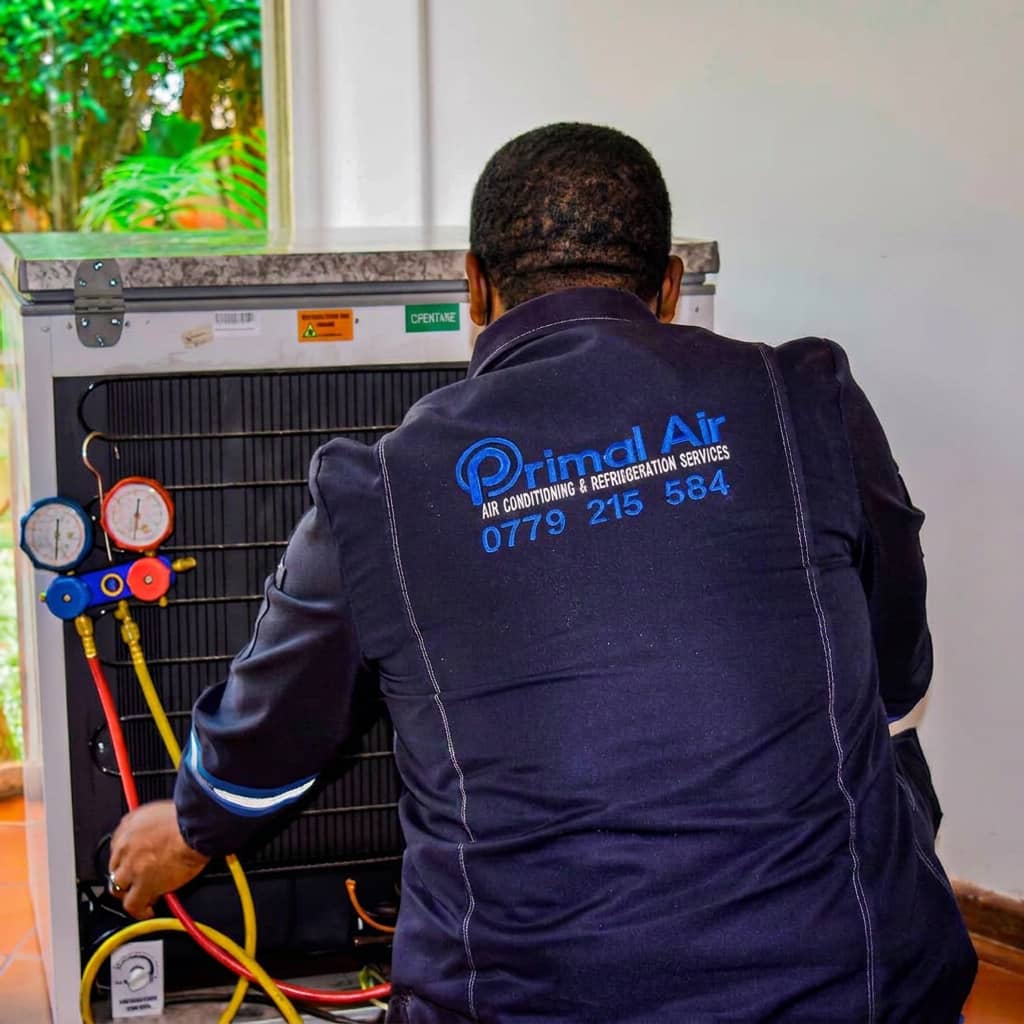 Primal Air technician regassing a chest freezer in Harare